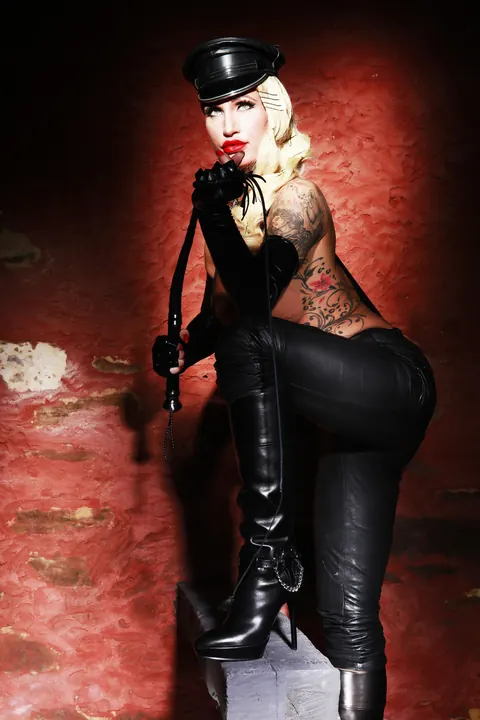 Busty Blonde MILF in Leather Uniform and Boots Shows Off Fetish Look – photo 8 of 16