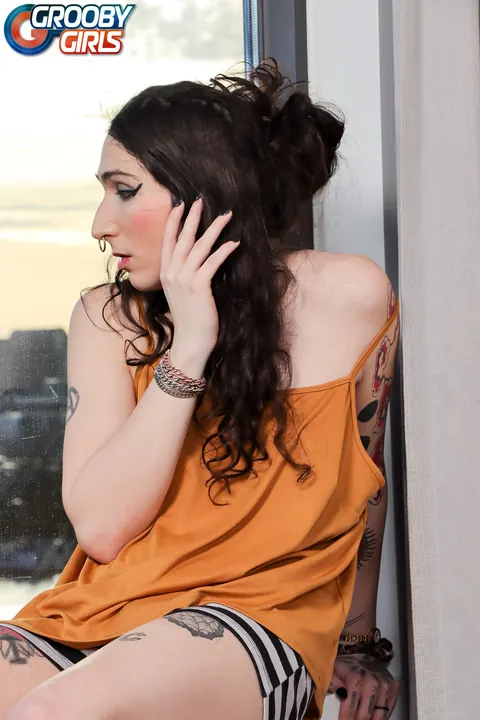 Tattooed Trans Woman Strips Nude and Strokes Her Cock – photo 2 of 16