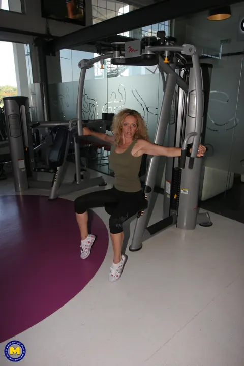 MILF in Yoga Pants and Shorts Strips at the Gym – photo 2 of 21