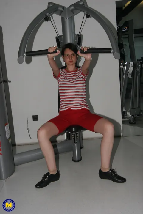 MILF in Yoga Pants and Shorts Strips at the Gym – photo 10 of 21