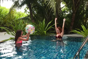 Candy Red – Russian Brunette and Redhead Lesbians Fuck with a Dildo in the Pool