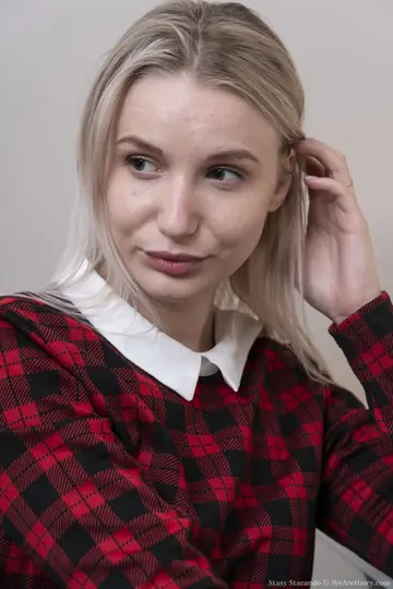 Blonde Removes Her Uniform and Fingers Her Hairy Pussy