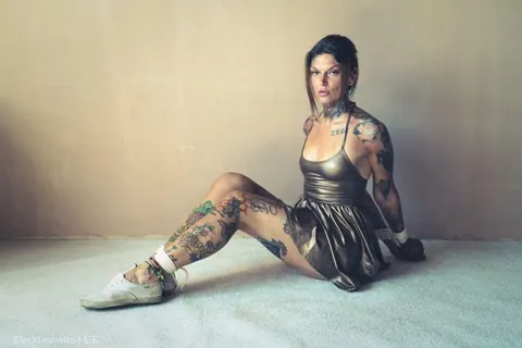 Tattooed Brunette Bound in a Hogtie Wearing a Skirt – photo 9 of 16