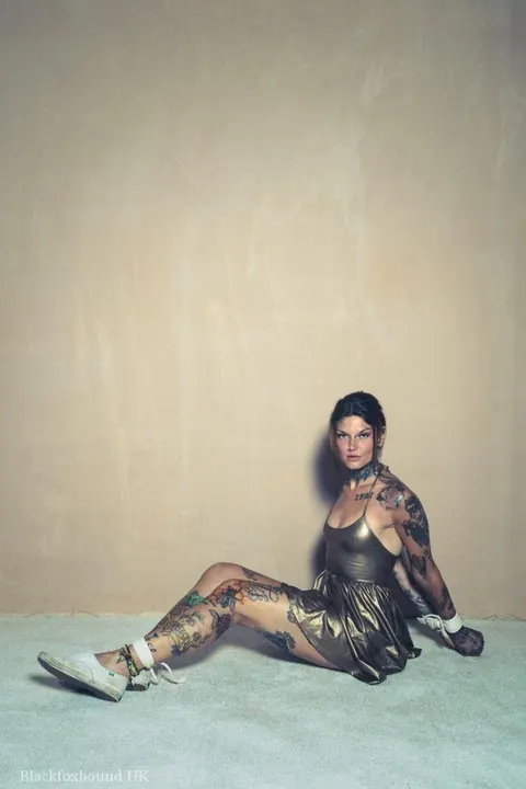 Tattooed Brunette Bound in a Hogtie Wearing a Skirt – photo 8 of 16