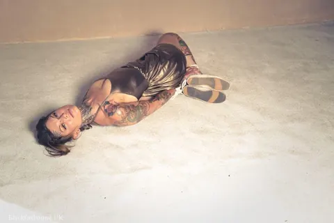 Tattooed Brunette Bound in a Hogtie Wearing a Skirt – photo 15 of 16