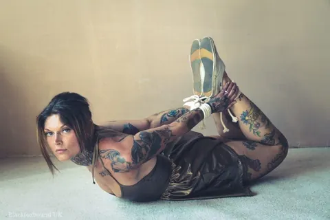 Tattooed Brunette Bound in a Hogtie Wearing a Skirt – photo 3 of 16