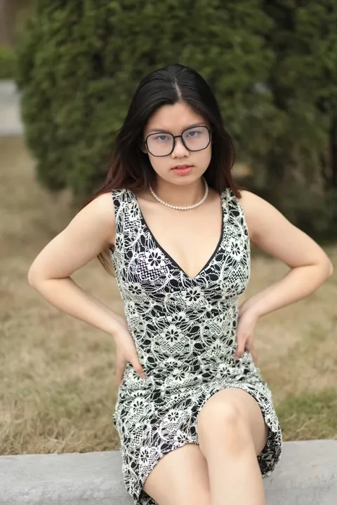 Asian Woman Poses in a Dress and Heels Outdoors – photo 4 of 21