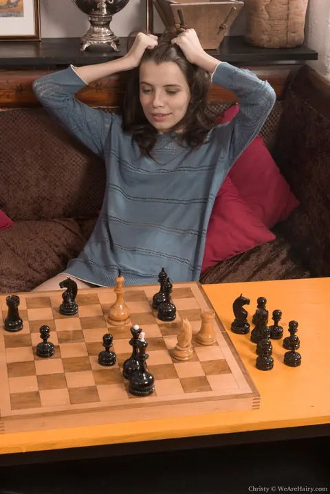 Olga Petrova: Slim Brunette Strips After Losing Strip Chess and Spreads Her Hairy Pussy – photo 2 of 16