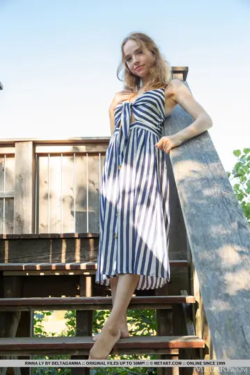 European Blonde Strips Out of Her Skirt on the Balcony Stairs