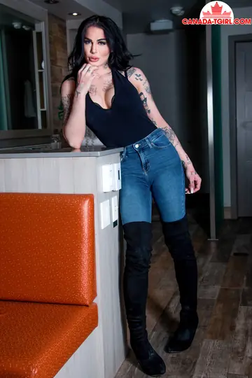 Tattooed Canadian Trans Woman Strips Out of Her Jeans in Stockings
