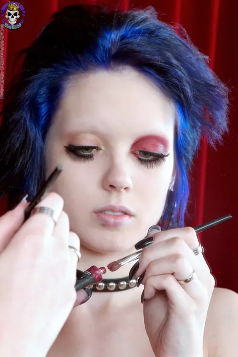 Woman Applies Makeup Topless in Panties Before a Mirror – photo 2 of 15