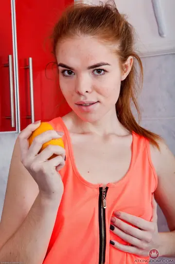 Redhead with Short Hair Spreads Her Hairy Pussy in the Kitchen