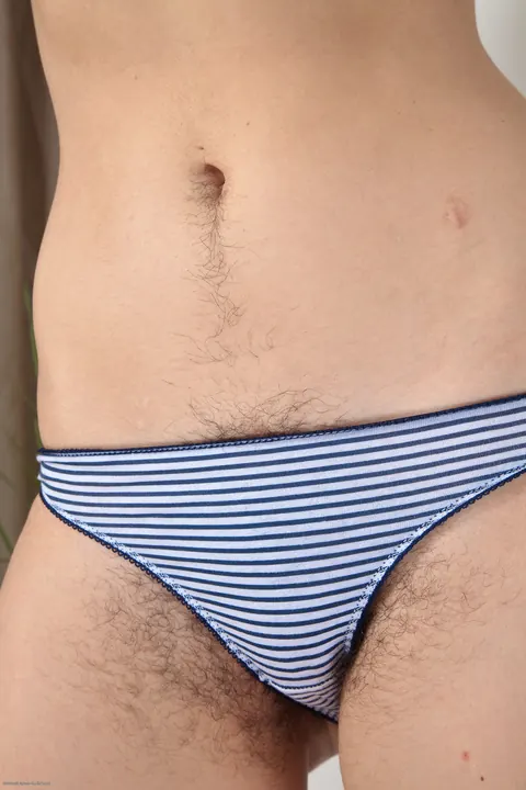 Pale Brunette Undresses and Shows Her Hairy Pussy – photo 11 of 21