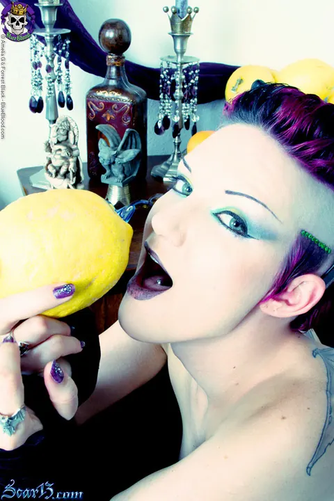 Scar 13: Tattooed Short-Haired Brunette Bites Citrus Fruit Nude – photo 13 of 15