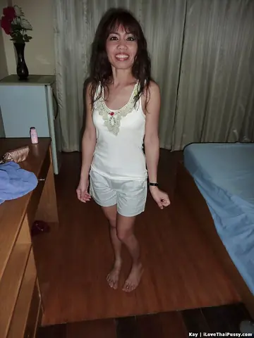 Kaay – Slim Asian Brunette Strips Nude and Spreads Her Legs