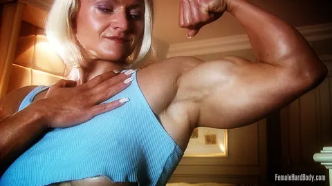 Brigita Brezovac: Blonde MILF Flexes Her Muscles and Flashes Her Big Tits – photo 14 of 21
