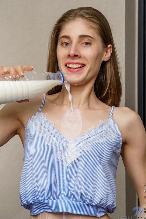 Amelinda: Skinny Brunette Drenches Tits and Pussy with Milk in the Kitchen – photo 5 of 16