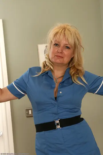 Thick Blonde MILF Strips Out of Her Uniform and Stockings