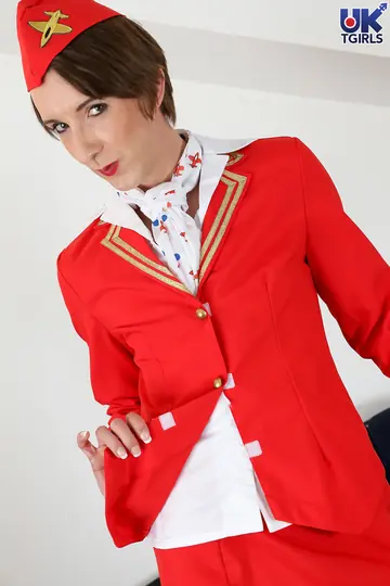 Slim Trans Woman in Stockings and Uniform Spreads Her Legs