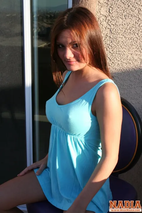 Redhead with Big Enhanced Tits Spreads on the Balcony – photo 1 of 15