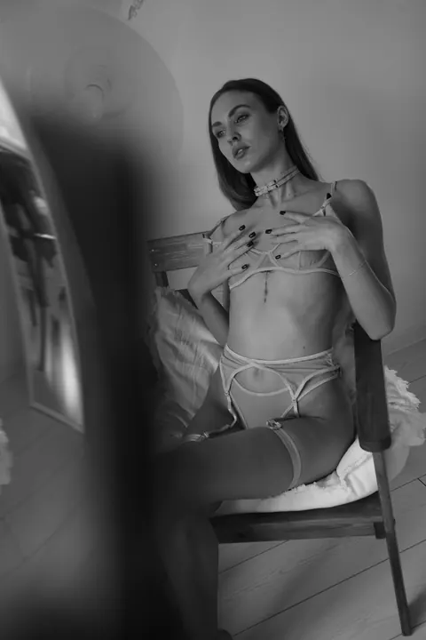 Slim Woman Models Lingerie in Her Bedroom – photo 10 of 11
