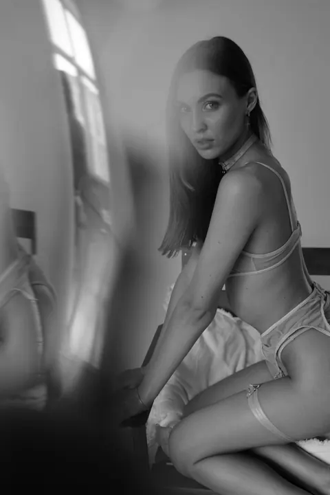 Slim Woman Models Lingerie in Her Bedroom – photo 7 of 11