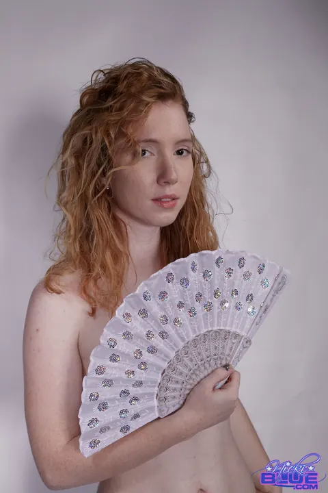 Nicki Blue: Redhead with Big Enhanced Tits Poses Nude for a Modeling Shoot – photo 7 of 15