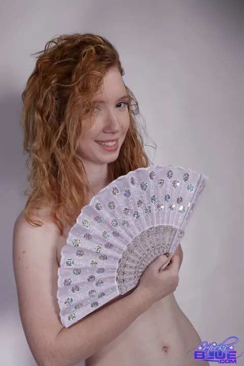 Nicki Blue: Redhead with Big Enhanced Tits Poses Nude for a Modeling Shoot – photo 15 of 15