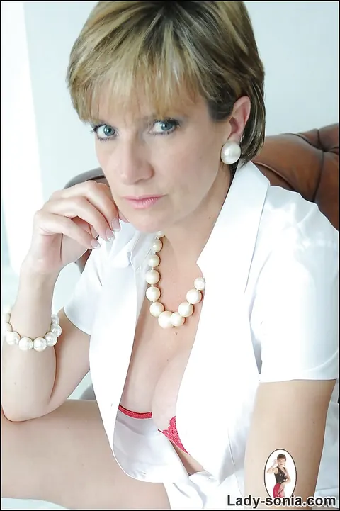 Lady Sonia: Blonde MILF Shows Her Big Tits in Lingerie on the Sofa – photo 15 of 15