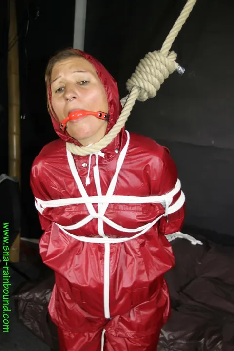 Woman in Raincoat Bound and Gagged with Ball Gag – photo 6 of 16
