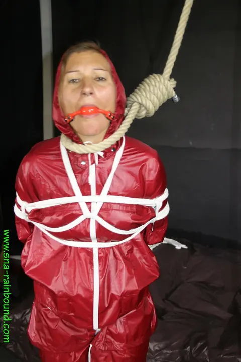 Woman in Raincoat Bound and Gagged with Ball Gag – photo 5 of 16