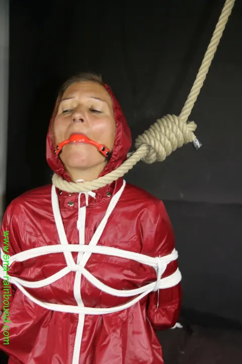 Woman in Raincoat Bound and Gagged with Ball Gag – photo 16 of 16