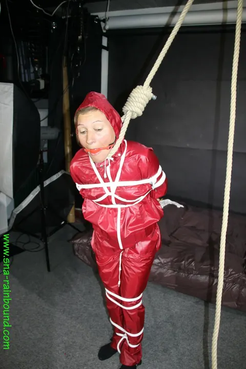 Woman in Raincoat Bound and Gagged with Ball Gag – photo 10 of 16
