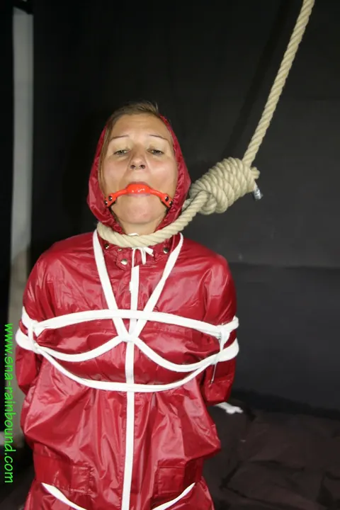 Woman in Raincoat Bound and Gagged with Ball Gag – photo 15 of 16