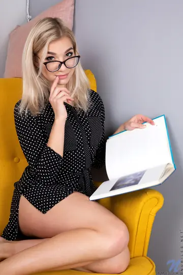 Blonde in Glasses Strips Off Her Lingerie and Fingers Her Pussy on the Chair