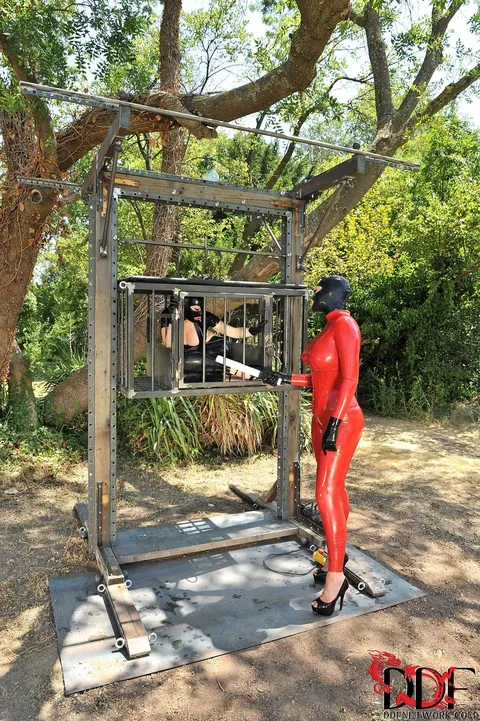 Latex Lucy: Tall British MILF in Glasses Dominates a Bound Woman Outdoors – photo 5 of 21