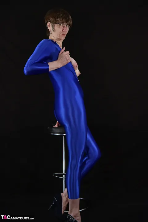 Mature Brunette Strips Bodystocking and Yoga Pants in Heels – photo 1 of 16