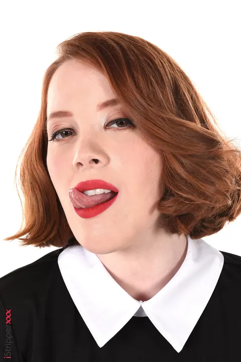 Lottie Magne: Short-Haired Redhead in Uniform Licks a Dildo and Shows Her Hairy Pussy – photo 5 of 15