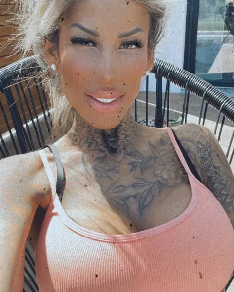 Blonde with Big Tits Flaunts Tattoo in a Bikini and Panties Outdoors – photo 15 of 17
