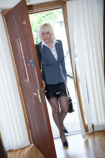 British Blonde MILF Strips Out of Her Skirt and Stockings in the Office