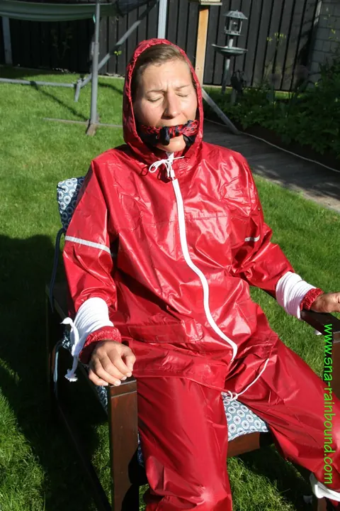 Amateur in Latex Bound to a Chair Outdoors – photo 9 of 16