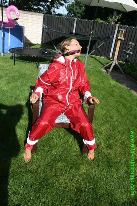 Amateur in Latex Bound to a Chair Outdoors – photo 4 of 16
