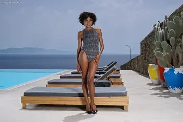 Busty Ebony Brunette Strips Out of Her Bodysuit Outdoors