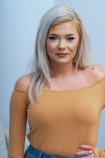 Blonde with Big Natural Tits and Tattoo Strips Nude and Poses