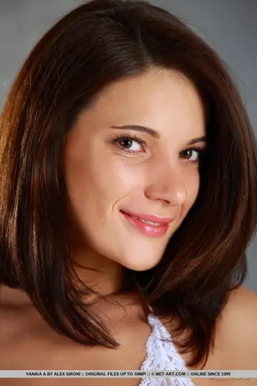 Brunette with Big Tits Strips and Spreads Her Shaved Pussy