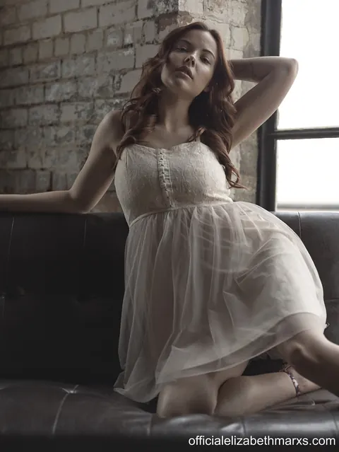 Elizabeth Marxs: Busty Redhead Spreads Her Legs While Clothed – photo 1 of 15