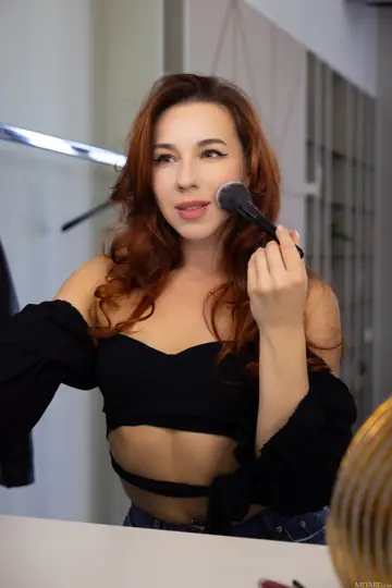 Redhead with Small Natural Tits Stands Nude and Turns Around