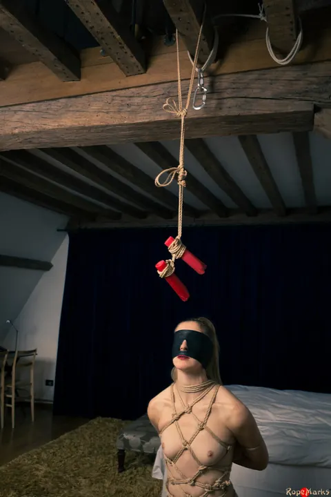 Dutch Woman with Pigtails Bound by Her Hair While Blindfolded – photo 9 of 16