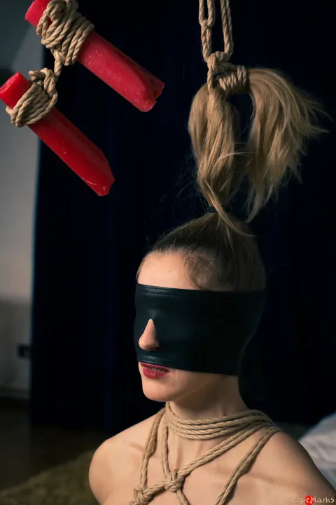 Dutch Woman with Pigtails Bound by Her Hair While Blindfolded – photo 13 of 16