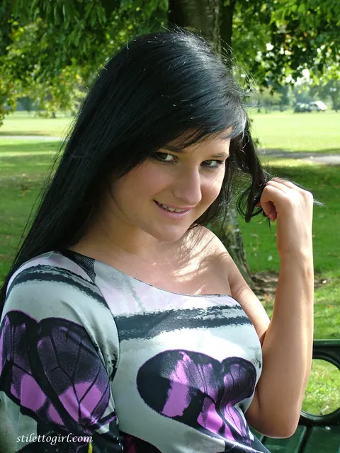 Brunette in Stockings and Heels Flashes Her Thighs on the Bench Outdoors – photo 8 of 16
